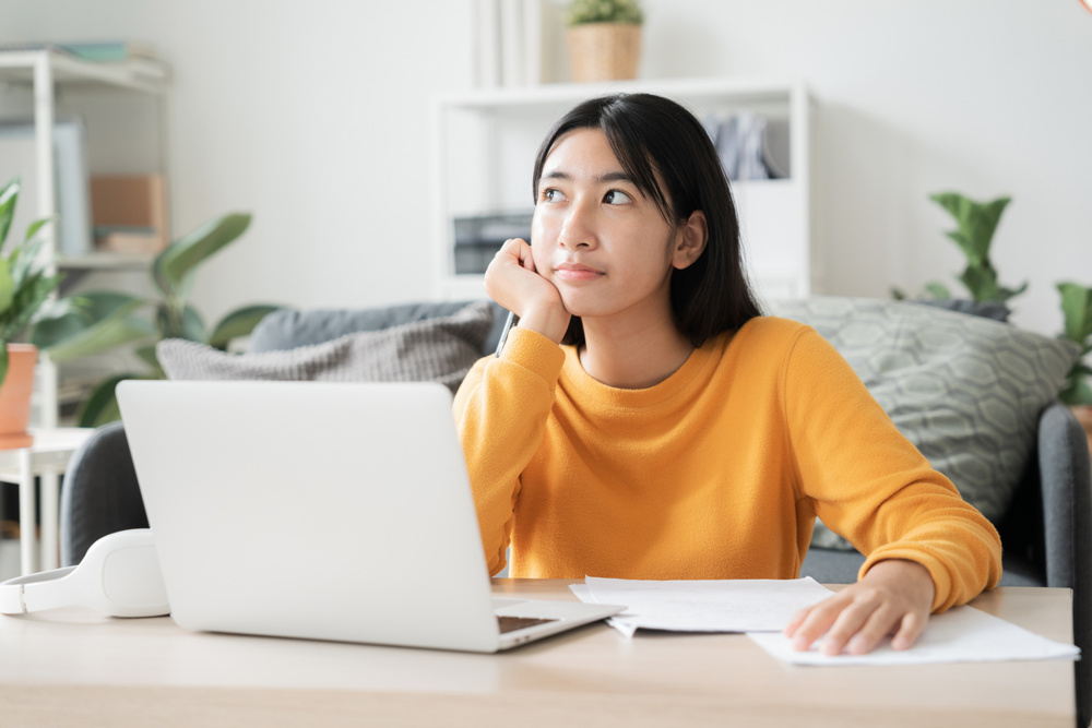 Asian girl online learn video conference via internet with tutor on computer