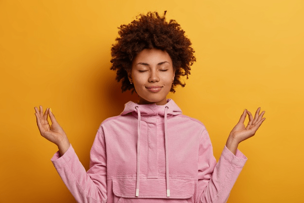 Picture of a woman meditating.