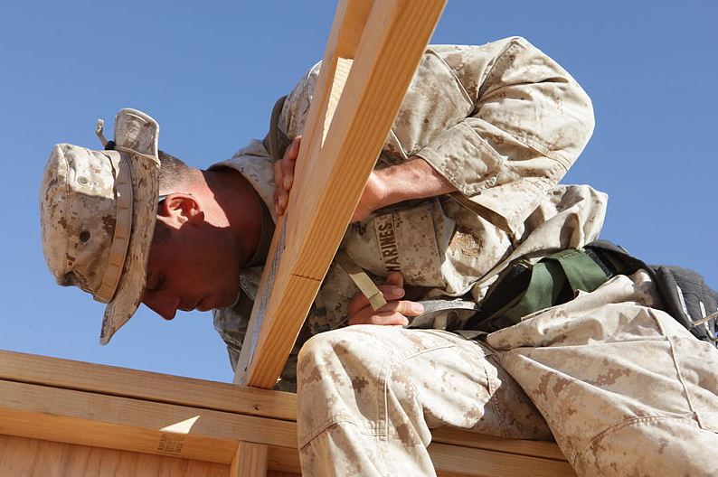 a soldier wearing a boonie hat