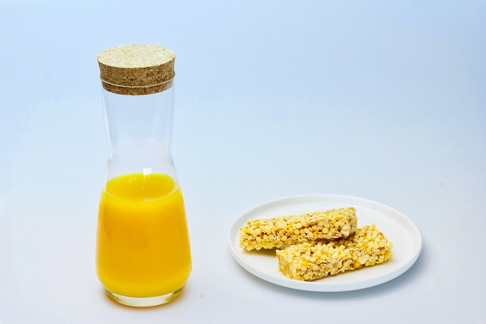 two breakfast bars with orange juice