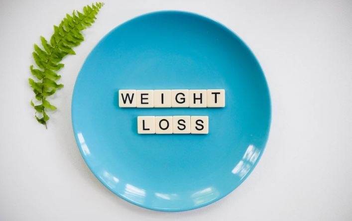 weight loss spelled on a plate