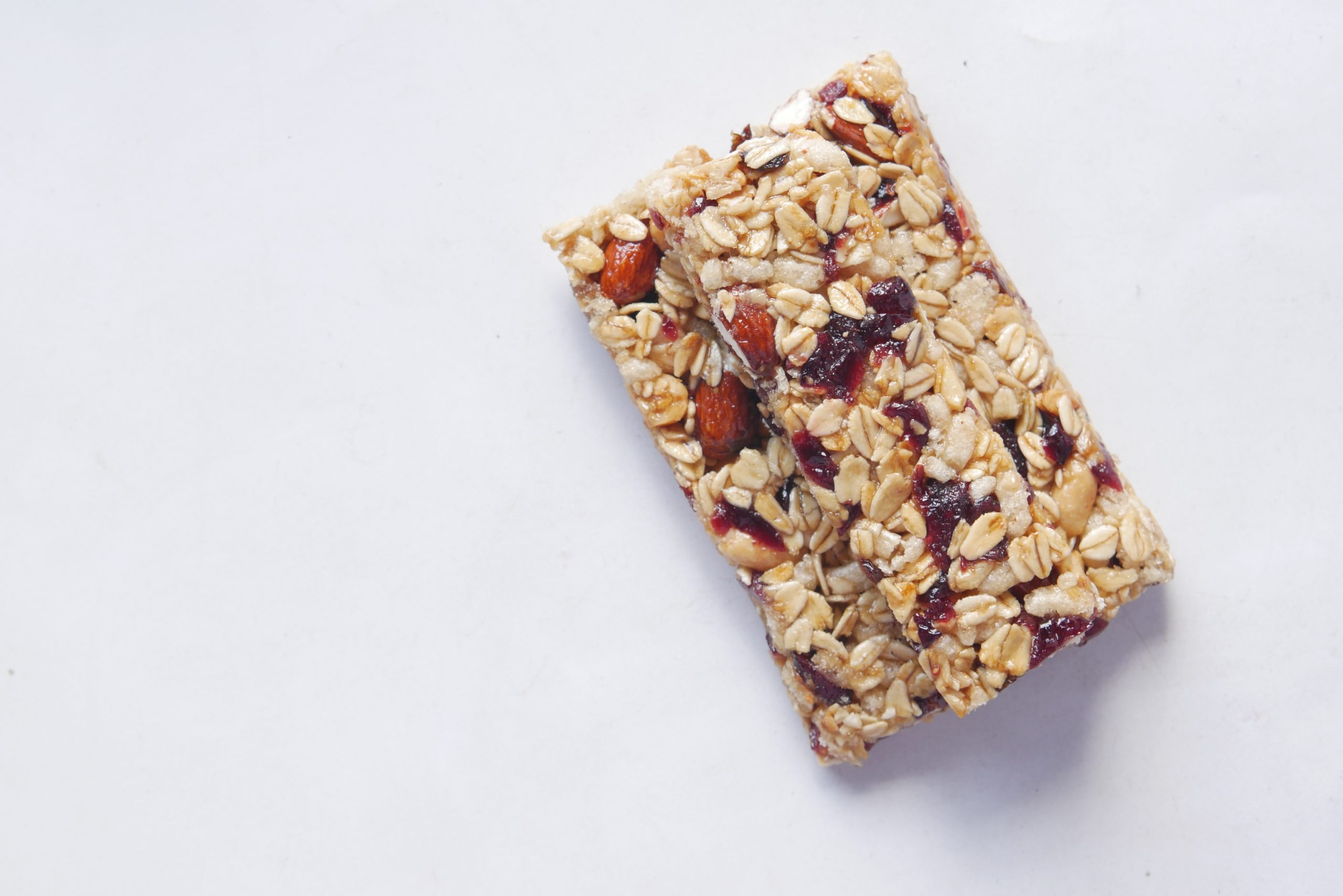 Top-view-of protein-bar-made-of-assorted-nuts-oats-and-dried-fruits