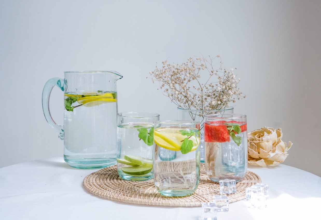 clear cups of water with fruits