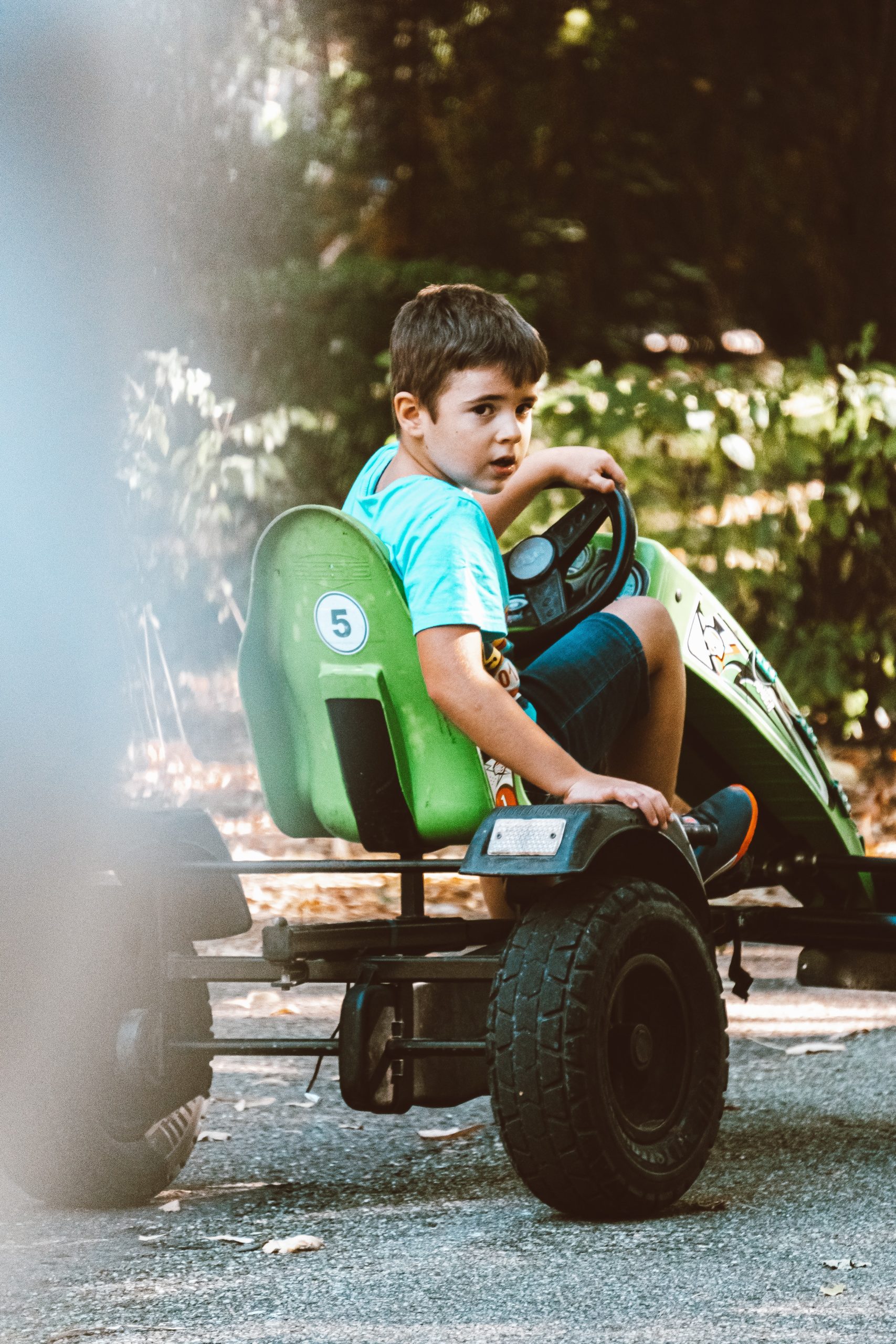 boy in green car