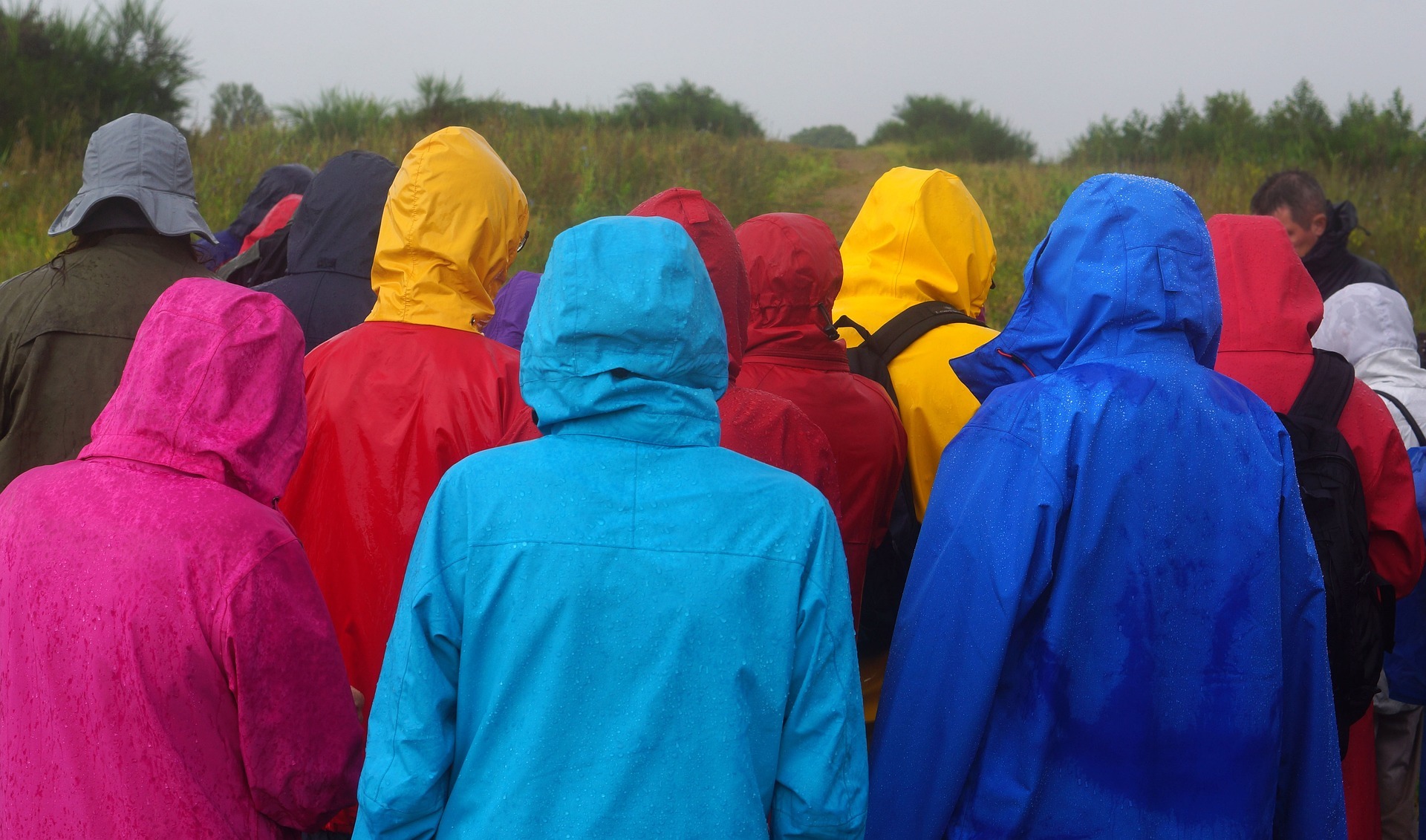 group of people wearing raincoats