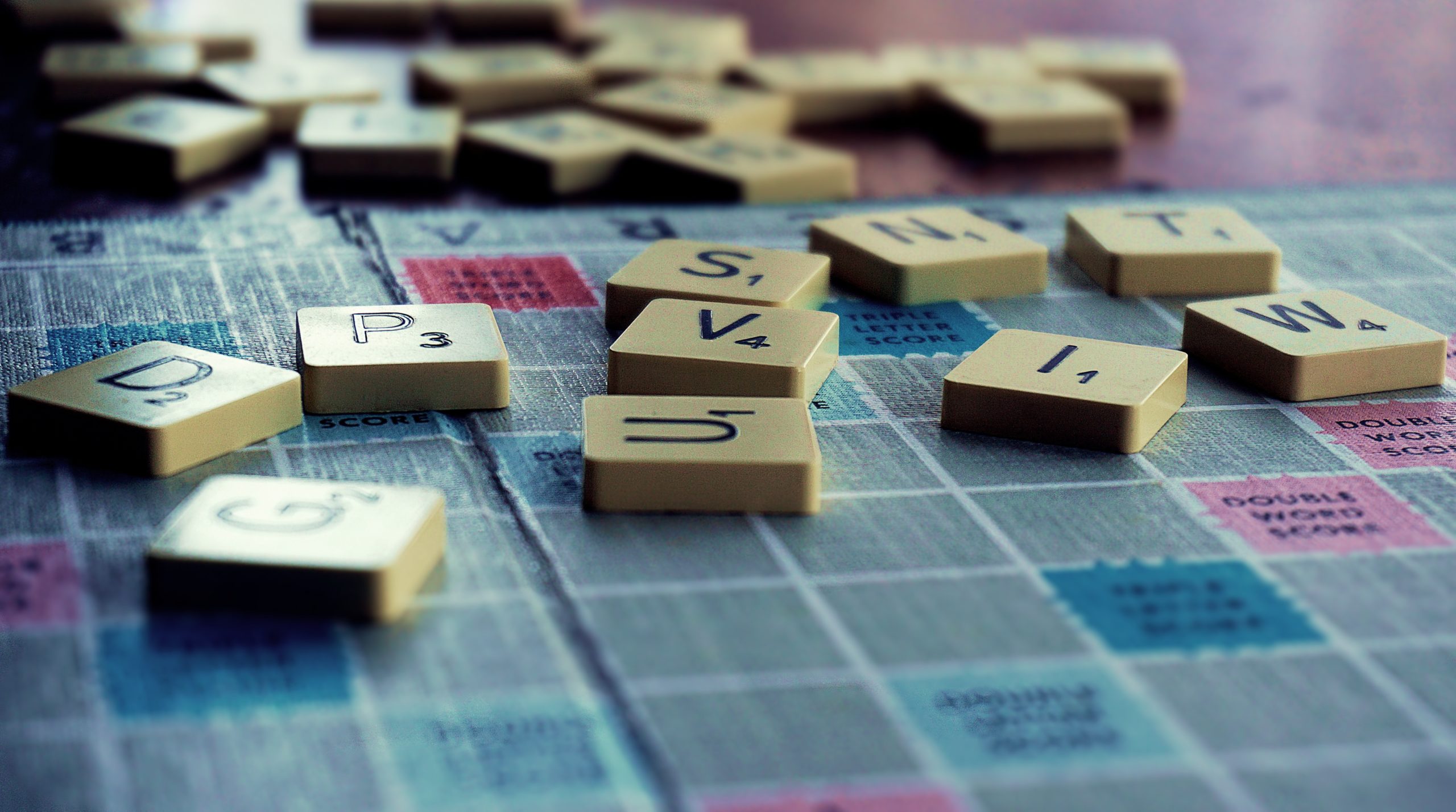 scrabble pieces on a board